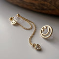 Clips d’oreilles asymétriques smiley